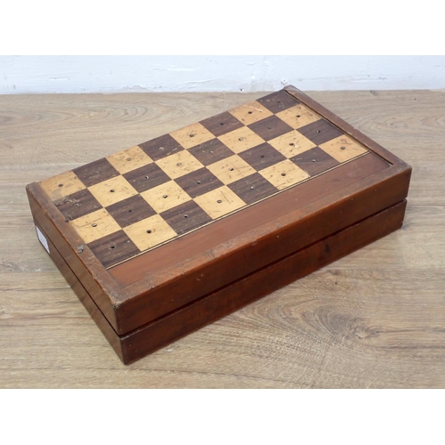 650 - A mahogany Games Board with two sets of draughts