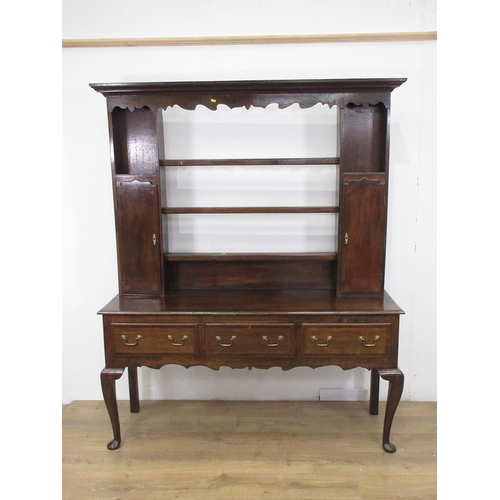 654 - A 19th Century oak and mahogany crossbanded Dresser and Rack the base fitted three frieze drawers mo... 