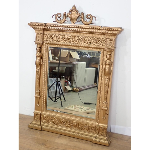 668 - A gilt framed Wall Mirror with mermaids and urn surmount 4ft 6in H x 3ft 2in W