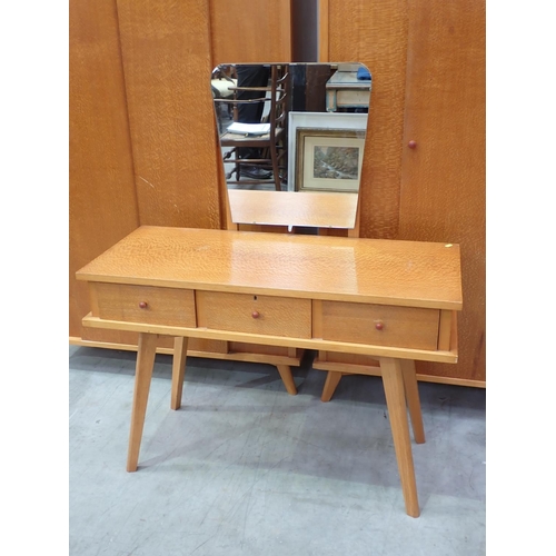 669 - A 20th Century Bedroom Suite comprising two Wardrobes, two Chests of Drawers and a Dressing Chest