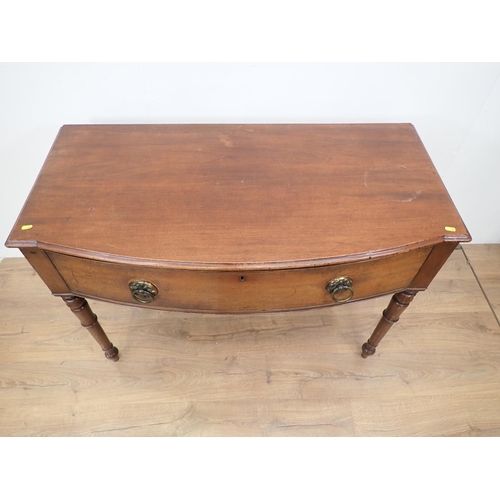 78 - A 19th Century mahogany bow fronted Serving Table fitted single frieze drawer and mounted upon turne... 