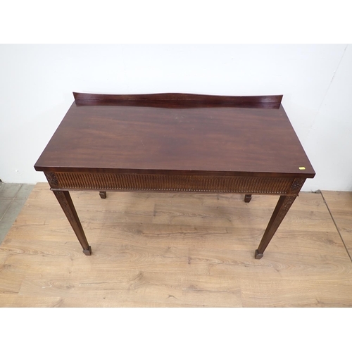 81 - A 19th Century mahogany Serving Table with nulled frieze mounted upon swag decorated square cut tape... 