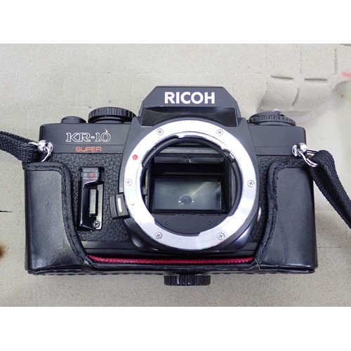 294 - A Ricoh KR-10 super 35mm Camera with Zeiss Jena3.5/135 lens, a Rikenon 2/50mm lens and a Sunagor 2.8... 