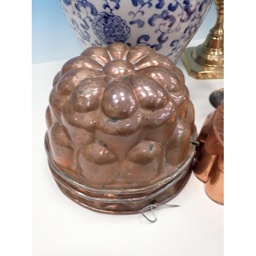 108A - A blue and white Jar and cover, another similar Table Lamp, a quantity of copper Jelly Moulds, a qua... 