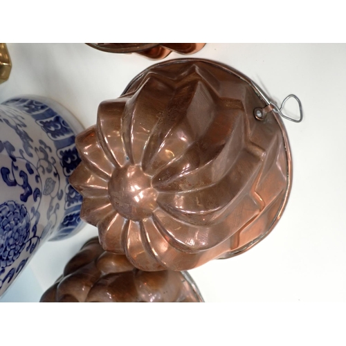 108A - A blue and white Jar and cover, another similar Table Lamp, a quantity of copper Jelly Moulds, a qua... 