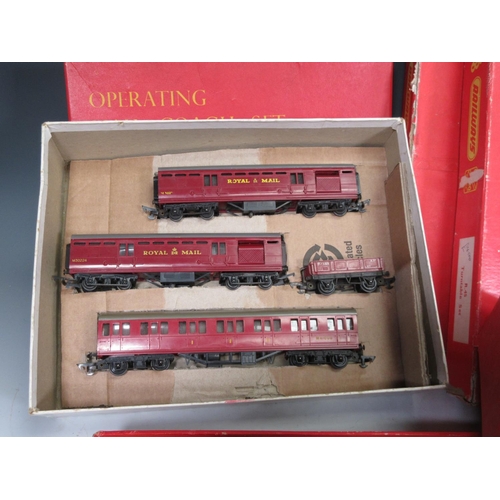 179 - A boxed Tri-ang 00 gauge Operating Mail Coach Set, a boxed Operating Ore Wagon Set and a boxed Turnt... 