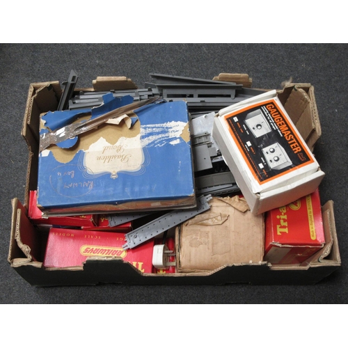 180 - A box of Tri-ang 00 gauge model Railway including boxed Engine Shed, Platform, two Controllers, boxe... 