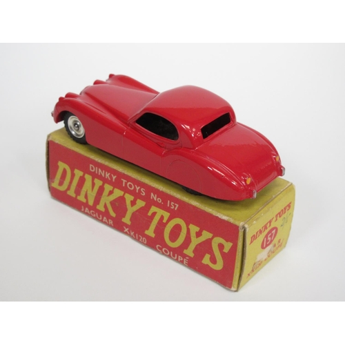 210 - A boxed Dinky Toys No.157 red Jaguar XK120 with spun hubs