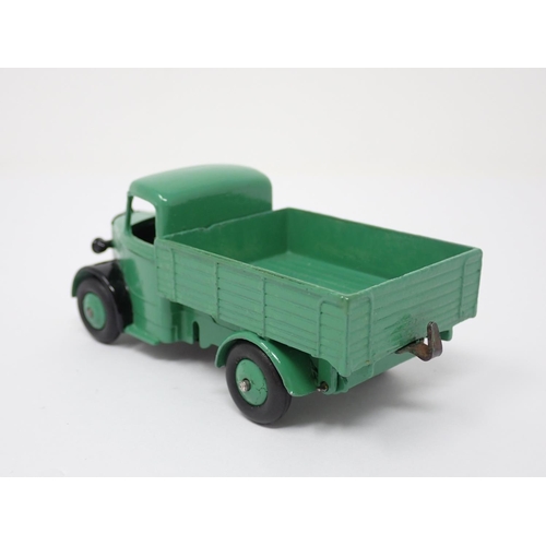 301 - An unboxed Dinky Toys No.25W rare Bedford Flat Truck with black front mud guards