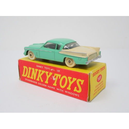 311 - A boxed Dinky Toys No.169 green and cream Studebaker Golden Hawk