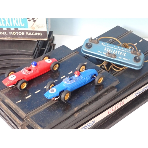 331 - A boxed Scalextric C/66 Cooper Racing Car, a boxed C/67 Lotus Racing Car and a quantity of Track