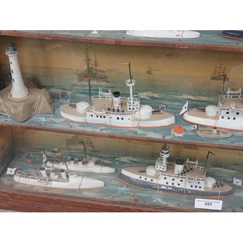 357 - A framed set of shelves with a diorama on each level of Ships with printed backgrounds 2ft 3 1/2in W... 