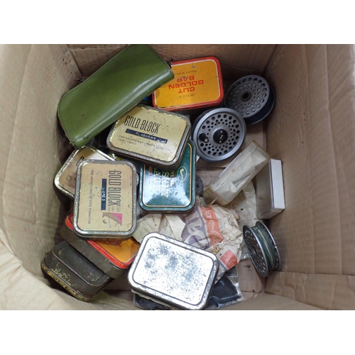 434 - A box containing two small Wheatley Fly Tins and various tins of Flies and other assorted Tackle,  H... 