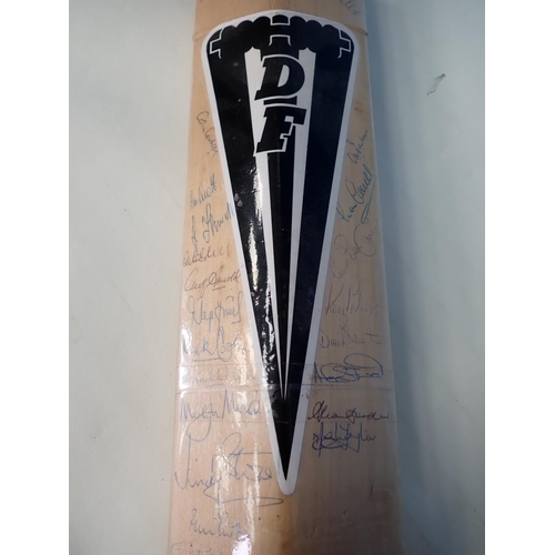 495 - A Duncan Fearnley Cricket Bat with signatures by players who have achieved 7000 runs in Test Matches... 