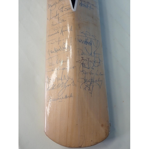 495 - A Duncan Fearnley Cricket Bat with signatures by players who have achieved 7000 runs in Test Matches... 