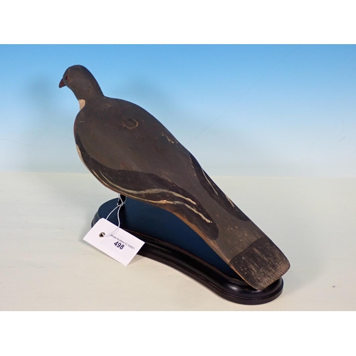 498 - A carved and painted Woodpigeon Decoy with glass eyes on ebonised stand 15in L