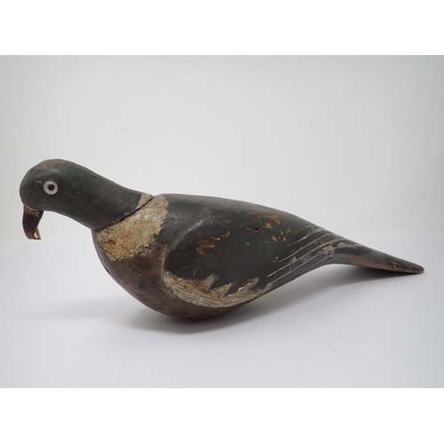 513 - An early 20th Century carved and painted Woodpigeon Decoy with glass eyes 15in L