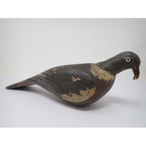 513 - An early 20th Century carved and painted Woodpigeon Decoy with glass eyes 15in L