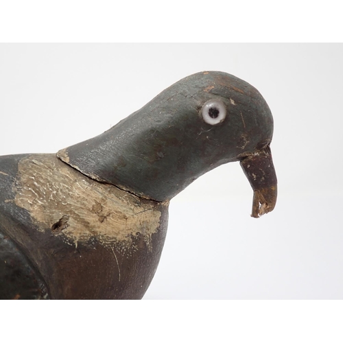 513 - An early 20th Century carved and painted Woodpigeon Decoy with glass eyes 15in L