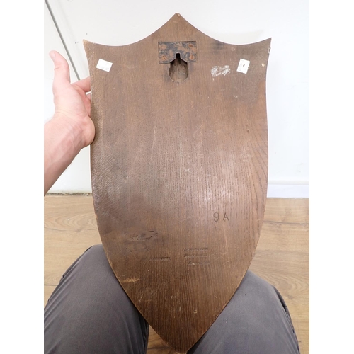 549 - A taxidermy Fox 'Death Mask' on oak shield with leather strap by Peter Spicer & Sons, with impressed... 