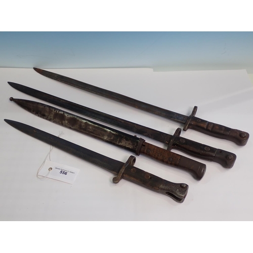 556 - An SMLE 1888 Pattern Bayonet, two 1907 Pattern Bayonets and another Bayonet in Scabbard