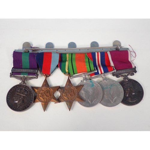 575 - A 1939/45 Trio, Pacific Star, Regular Army & Good Conduct Medals, and a Palestine Medal with bar, en... 