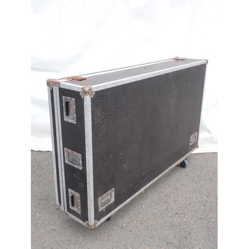 652 - A large Flight Case, 69in W x 15in H x 40in D fitted with casters