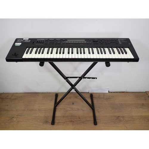 654 - A Roland XP30 Electric Keyboard with 64-Voice Expandable Synthesizer on Stand