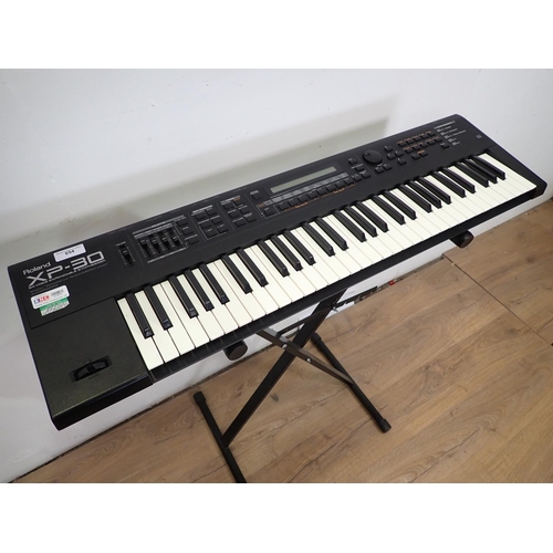 654 - A Roland XP30 Electric Keyboard with 64-Voice Expandable Synthesizer on Stand