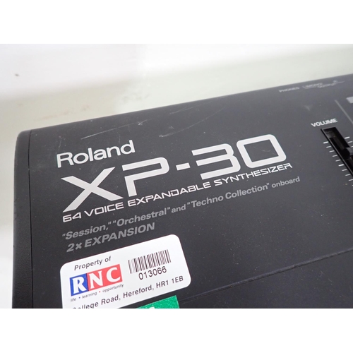 655 - Two Roland XP-30, Electric Keyboards with 64 Voice Expandable Synthesizers, one A/F, one Stand