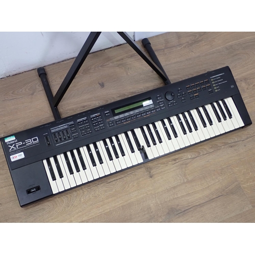 655 - Two Roland XP-30, Electric Keyboards with 64 Voice Expandable Synthesizers, one A/F, one Stand