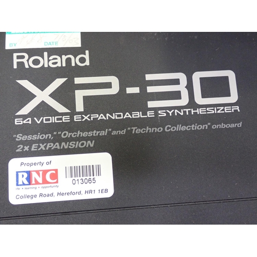 655 - Two Roland XP-30, Electric Keyboards with 64 Voice Expandable Synthesizers, one A/F, one Stand