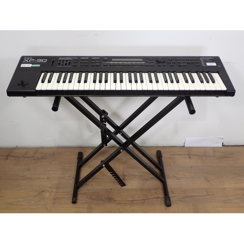 657 - A Roland XP-30, Electric Keyboard with 64 Voice Expandable Synthesizer on Stand