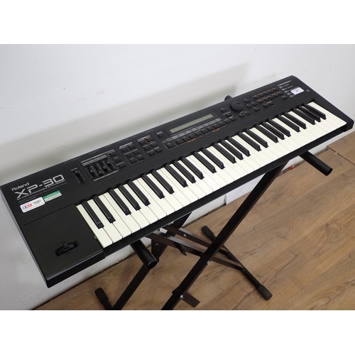 657 - A Roland XP-30, Electric Keyboard with 64 Voice Expandable Synthesizer on Stand