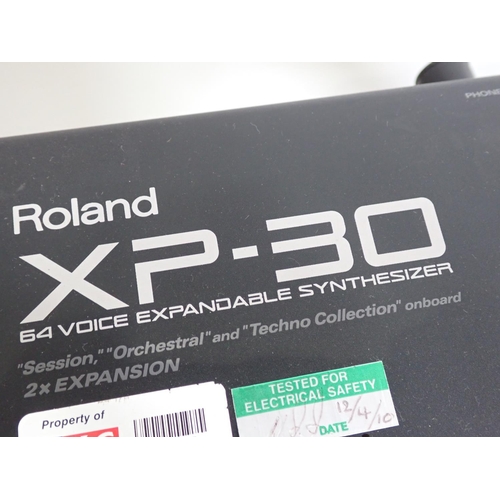 657 - A Roland XP-30, Electric Keyboard with 64 Voice Expandable Synthesizer on Stand