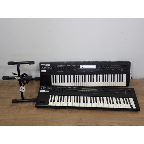 658 - Two Roland XP-30, Electric Keyboards with 64 Voice Expandable Synthesizers (one A/F), one Table Stan... 