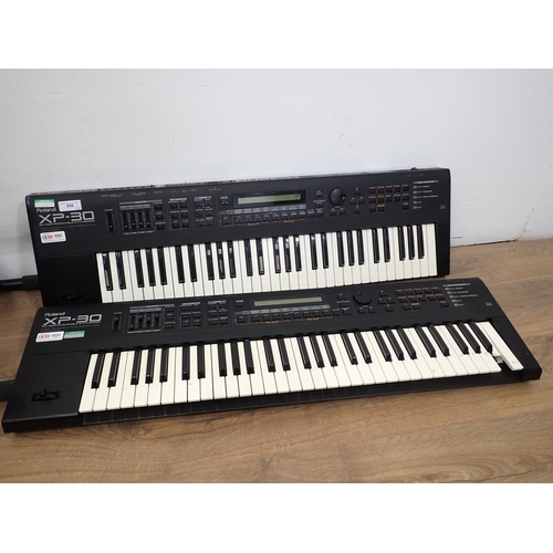 658 - Two Roland XP-30, Electric Keyboards with 64 Voice Expandable Synthesizers (one A/F), one Table Stan... 