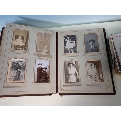 84 - A Victorian Photograph Album, portrait photographs and family groups, some loose photographs and a s... 