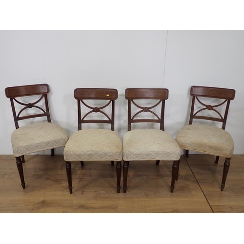 43 - A set of four 19th Century mahogany Dining Chairs with X-frame backs and cream stuff over seats