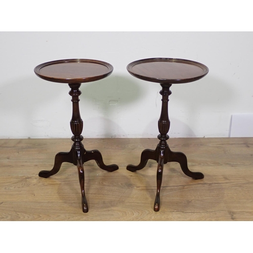 1011 - A pair of Georgian style mahogany Wine Tables with turned and fluted columns on tripod bases, 12in