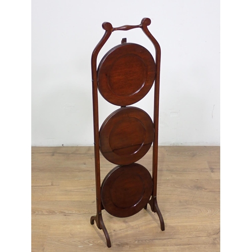 1013 - A mahogany three tier folding Cakestand