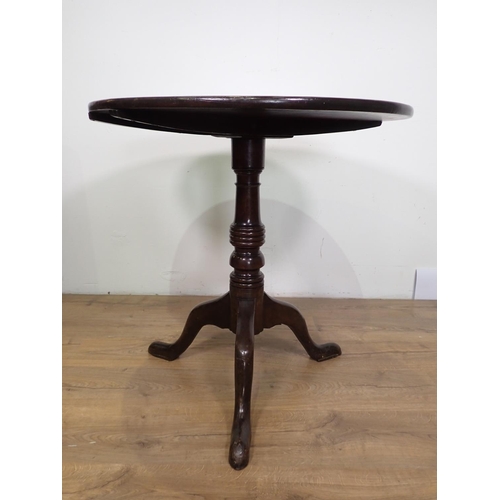 1021 - A Georgian mahogany Pillar Table with circular top on turned column and tripod base, 2ft 6in diam, s... 