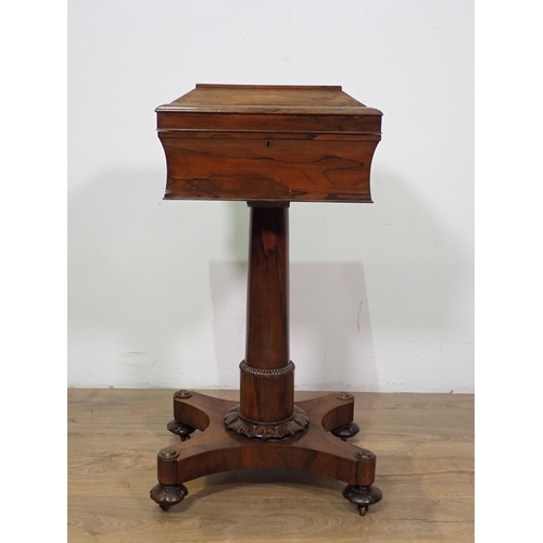 1024 - A William IV rosewood Teapoy of sarcophagus shape on tapering column, carved circular feet and caste... 