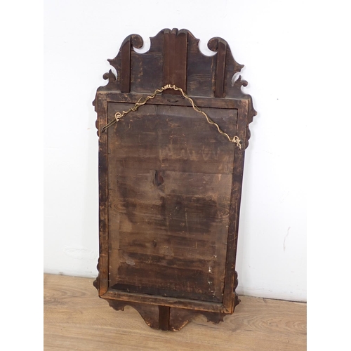 1031 - A Georgian walnut Wall Mirror with gilt scallop surmount, gilt slip, shaped surmount, 2ft 6in