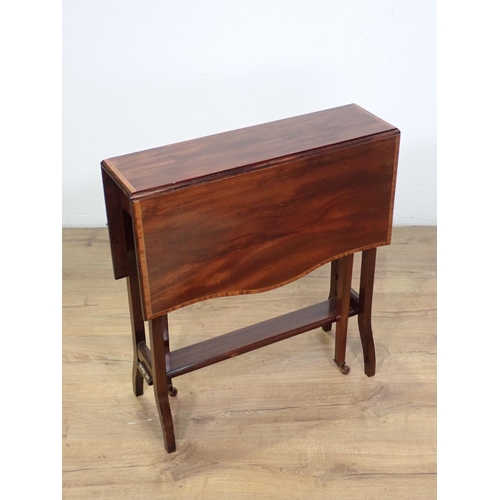 1032 - An Edwardian mahogany Sutherland Table cross-banded with satinwood, butterfly top on square supports... 