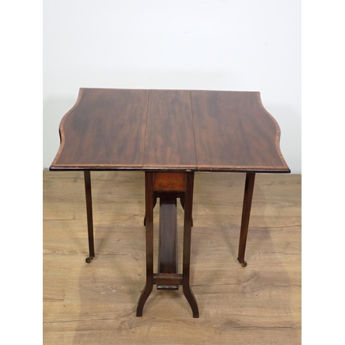 1032 - An Edwardian mahogany Sutherland Table cross-banded with satinwood, butterfly top on square supports... 