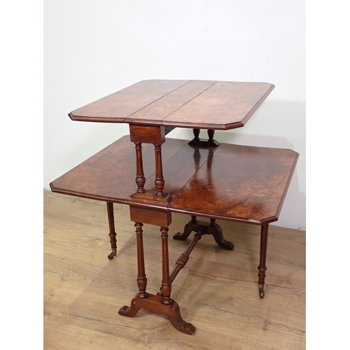 1033 - A Victorian burr walnut veneered two tier Sutherland Table on turned cheval frame, 23in