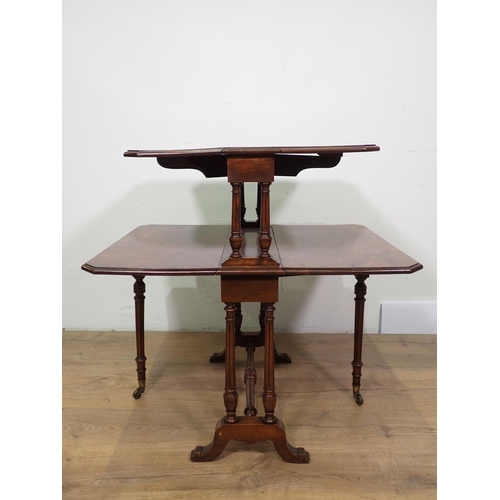 1033 - A Victorian burr walnut veneered two tier Sutherland Table on turned cheval frame, 23in