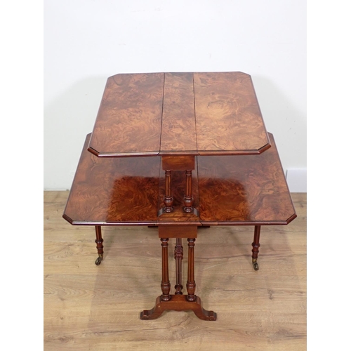 1033 - A Victorian burr walnut veneered two tier Sutherland Table on turned cheval frame, 23in