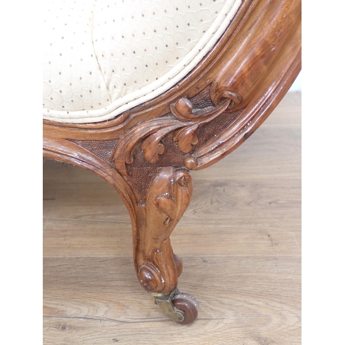 1034 - A Victorian walnut framed Chaise Longue on cabriole legs and casters with acorn finials, 4ft 6in